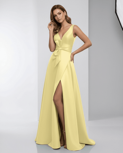 Lumia Maxi Dress featuring a yellow satin A-line silhouette, elegant deep V-neck, and chic bow detail, by Lauven.