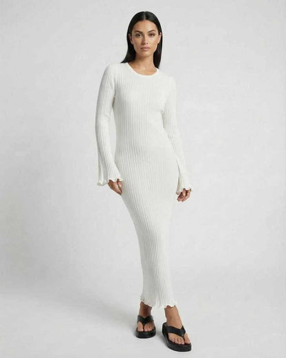 Lauven Luna Maxi Dress in crisp white, featuring ribbed knit fabric, long flared sleeves, and elegant silhouette.