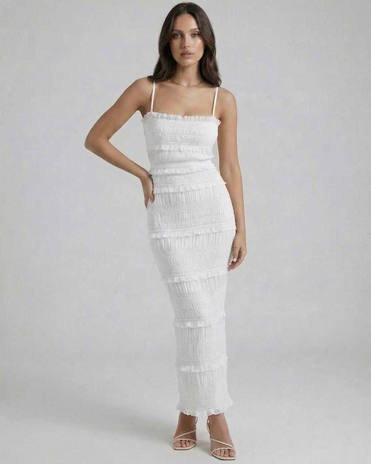 Luna Maxi Dress by Lauven featuring a sleek sheath silhouette in crisp white with spaghetti straps and subtle pleating.