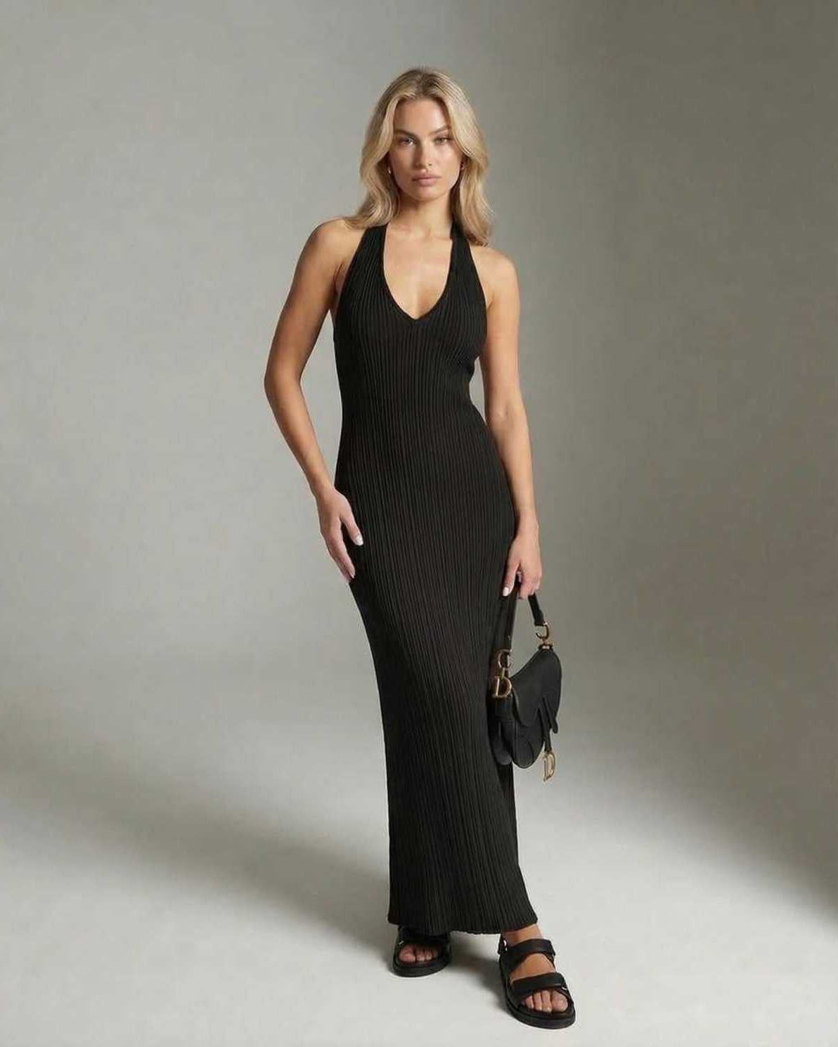 Luna Maxi Dress by Lauven, a sleek black ribbed knit sleeveless dress with a V-neckline and slim fit silhouette.