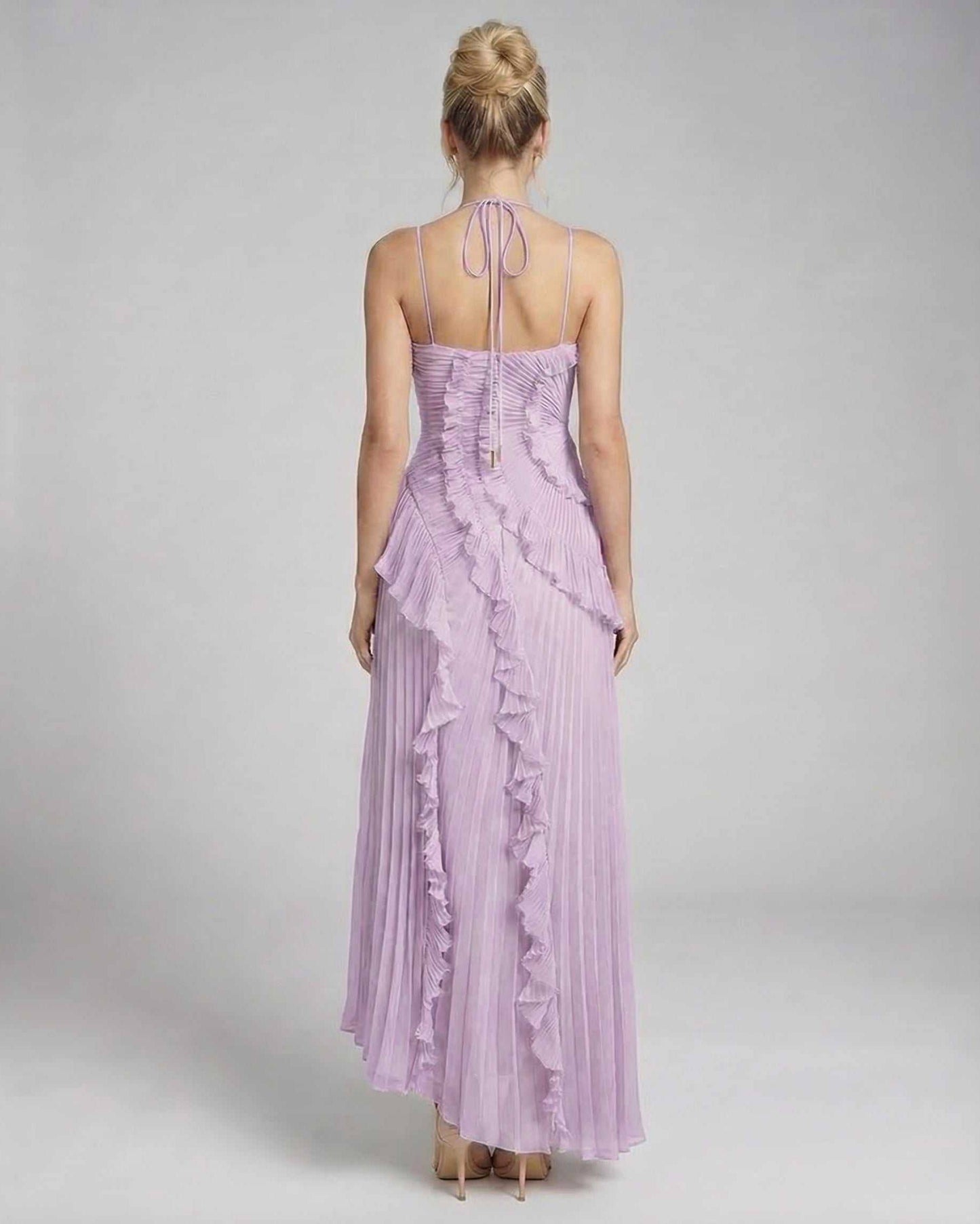 Luna Maxi Dress by Lauven in soft lavender, showcasing pleated fabric and ruffles from the back view.