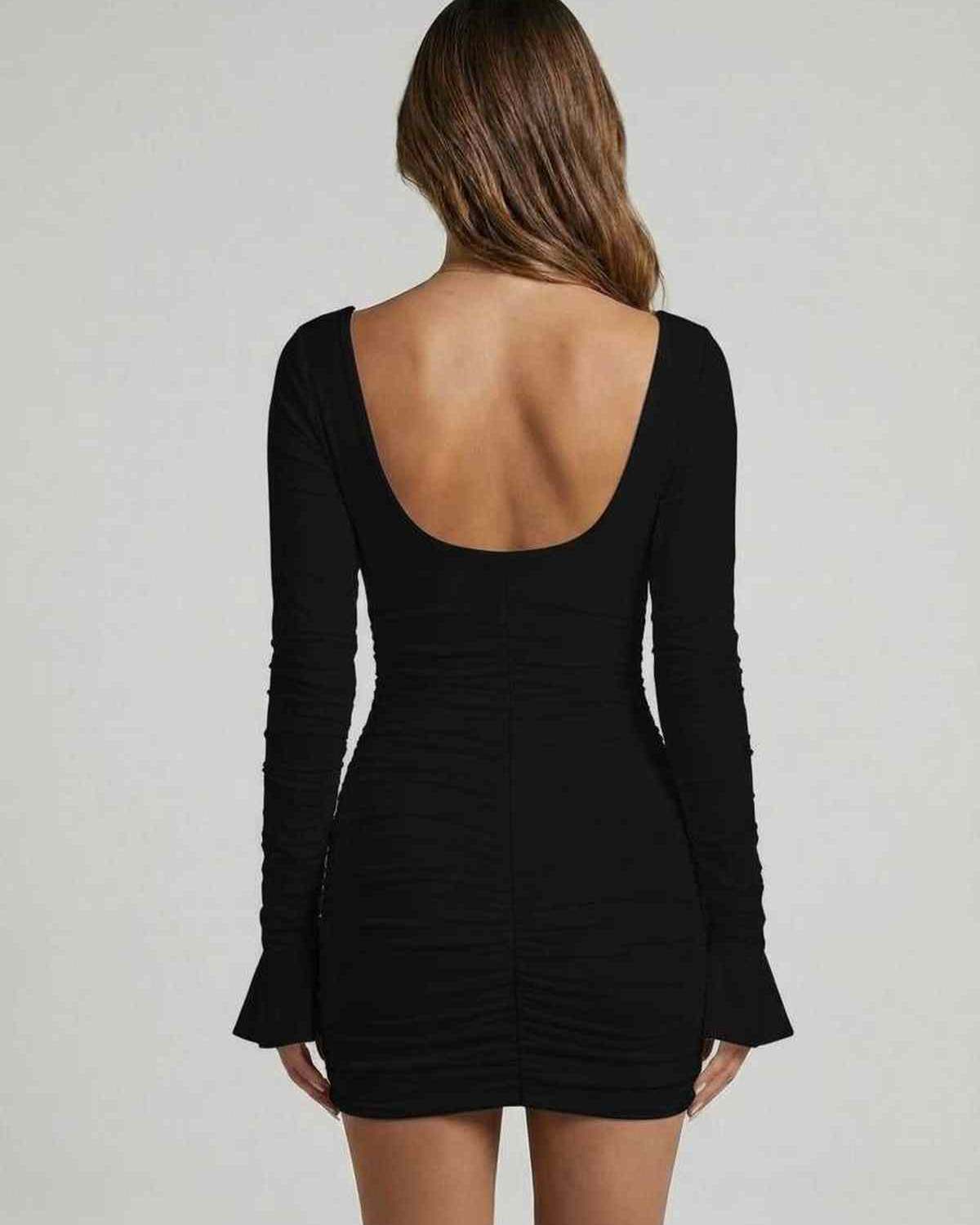 Lauven Luna Mini Dress with long sleeves, cut-out detailing, and sleek black fabric, showcasing the back view.