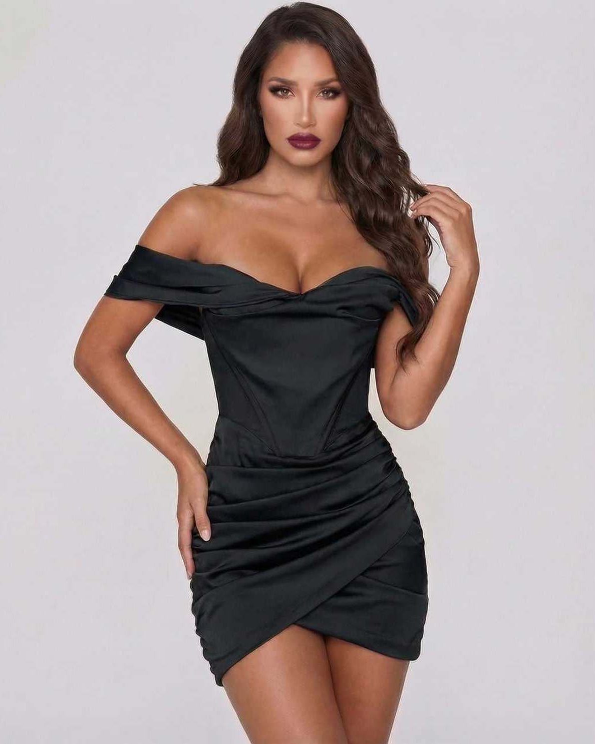 Lauven Luna Mini Dress - Sleek black satin off-shoulder dress with ruched skirt and elegant draped detailing.
