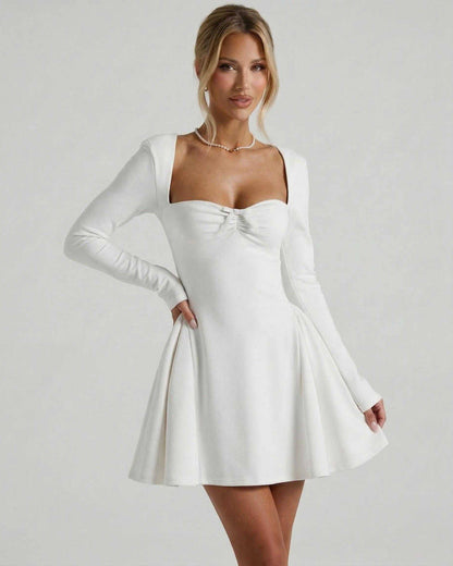 Lauven Luna Mini Dress features a classic white color, square neckline, and ruched bow detail for timeless elegance.