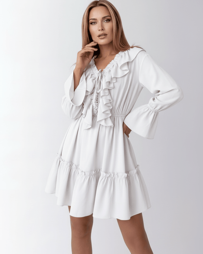 Luna Mini Dress by Lauven featuring ruffled V-neck and elastic waist for a flattering silhouette in white.