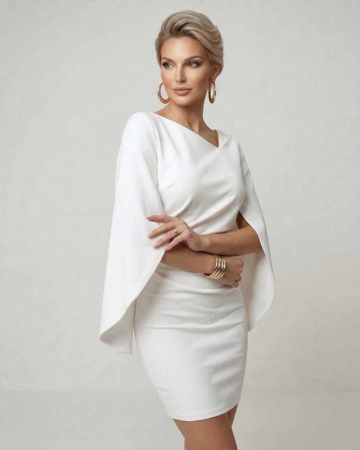 Luna Mini Dress by Lauven featuring cloak sleeves and a sheath silhouette in white fabric, perfect for parties.
