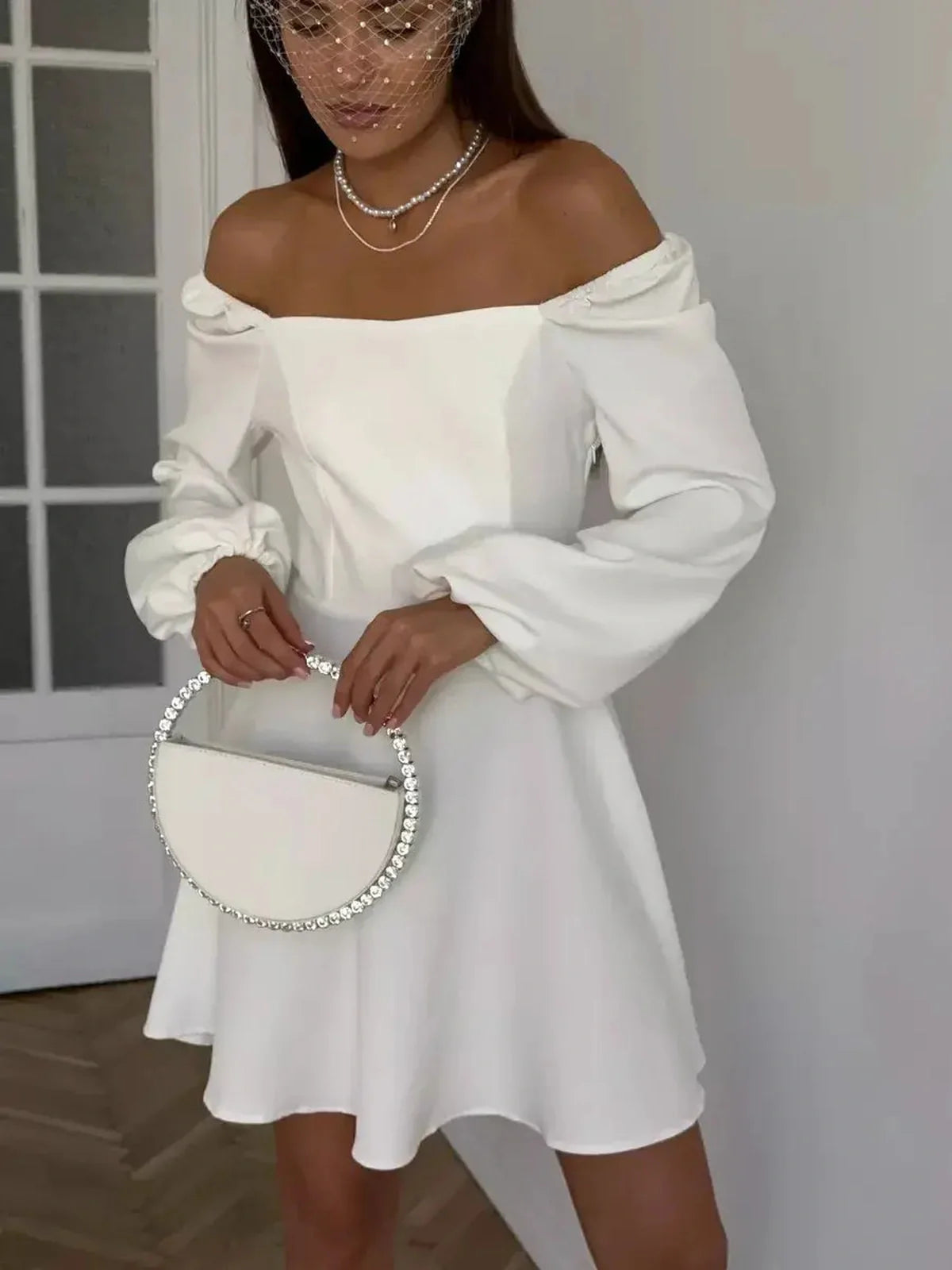 Luna Whisper off-shoulder white mini dress featuring voluminous sleeves, perfect for weddings, proms, and special occasions.