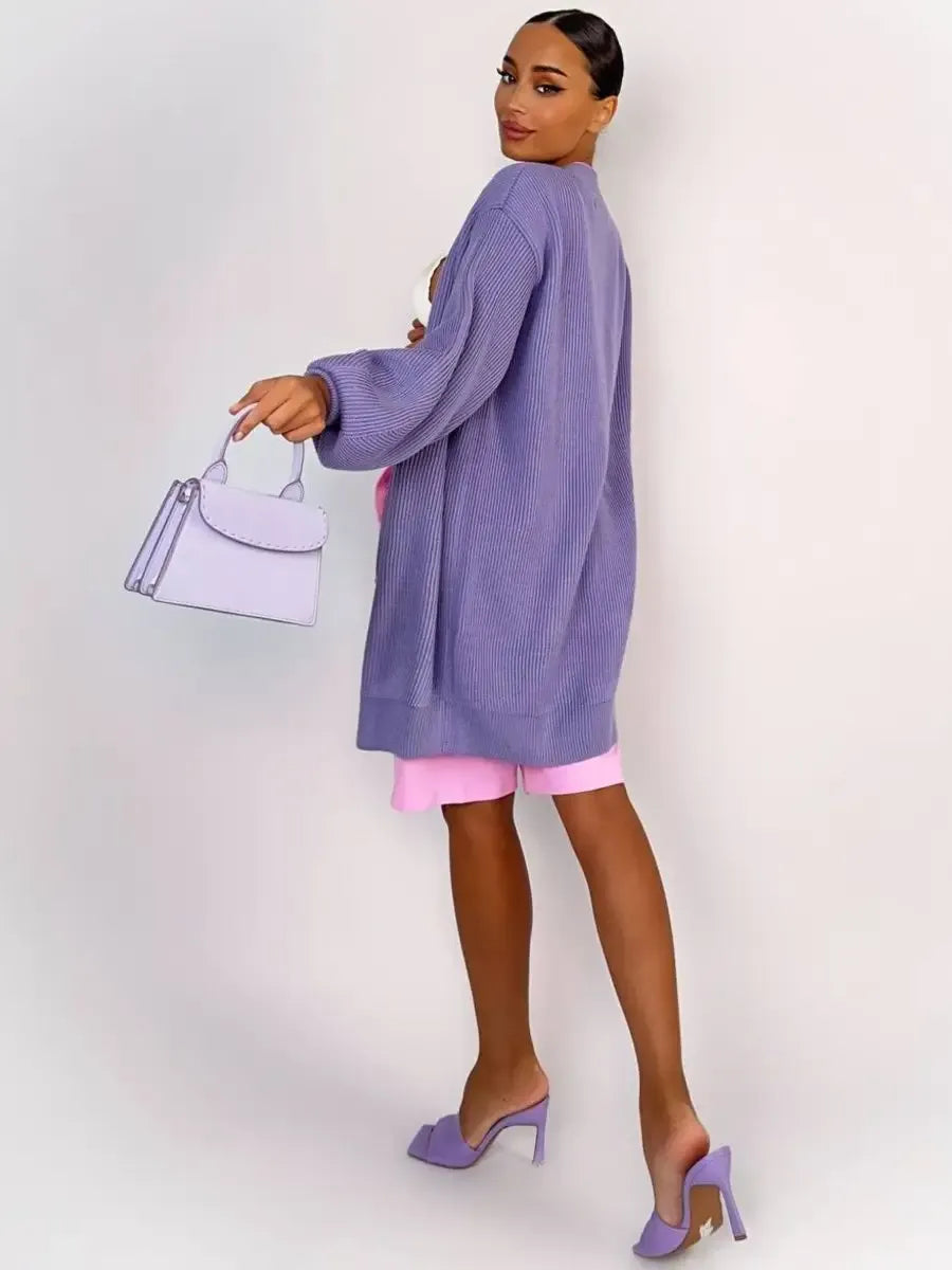 Model showcasing the Lunaria Cardigan by Lauven in oversized lavender knit with stylish accessories.