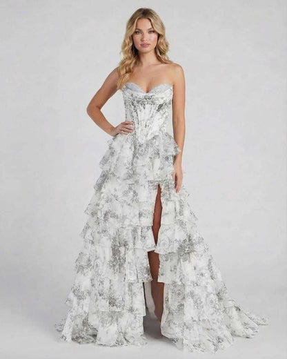 Lunaria Maxi Dress by Lauven in silver floral chiffon with tiered ruffles and high slit.