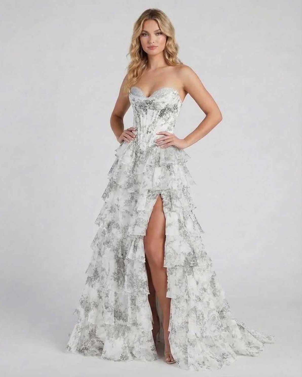 Lunaria Maxi Dress by Lauven features a sophisticated silver floral tiered chiffon design with a high slit.