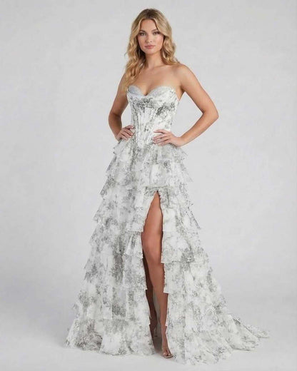 Lunaria Maxi Dress by Lauven features a sophisticated silver floral tiered chiffon design with a high slit.