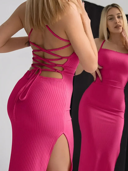 Lush Lace Midi Dress in pink, featuring a lace-up back, thigh-high side slit, and strappy design for an elegant silhouette.