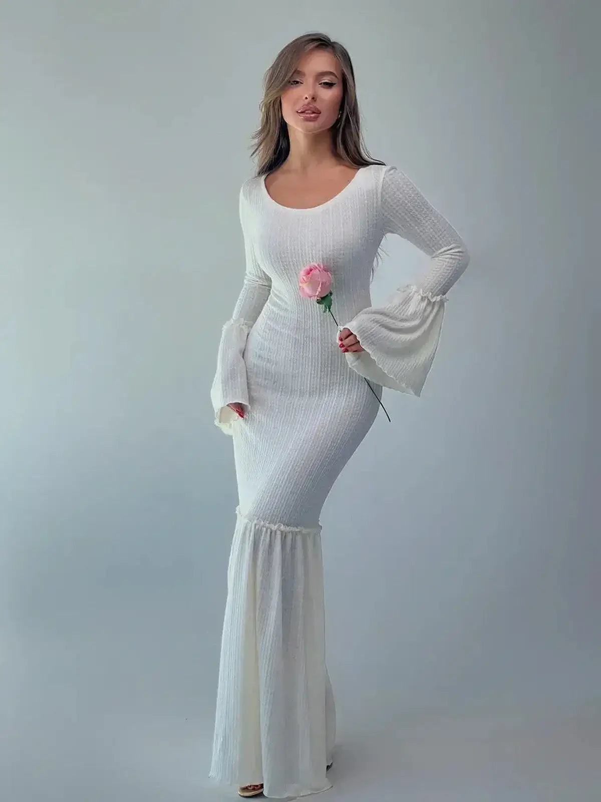 Lustre Maxi Dress featuring sculpted knit silhouette and bell sleeves, elegant style for formal events.