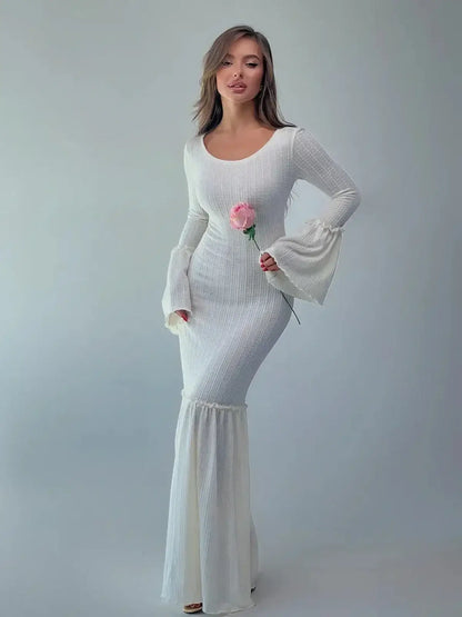 Lustre Maxi Dress featuring sculpted knit silhouette and bell sleeves, elegant style for formal events.