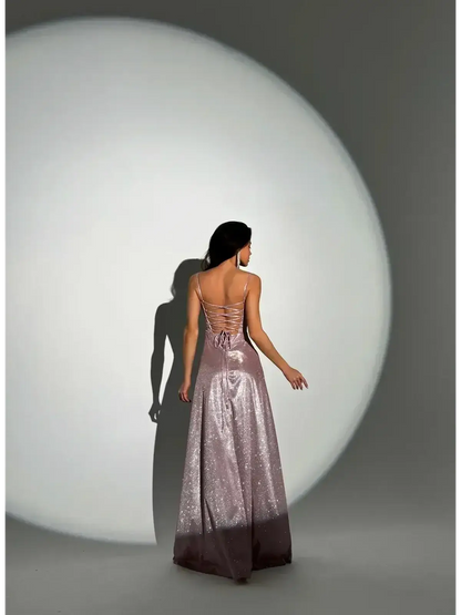Elegant back view of the Lustrous Spell Maxi Dress in blush-pink, showcasing its sculpted bodice and flowing hemline.