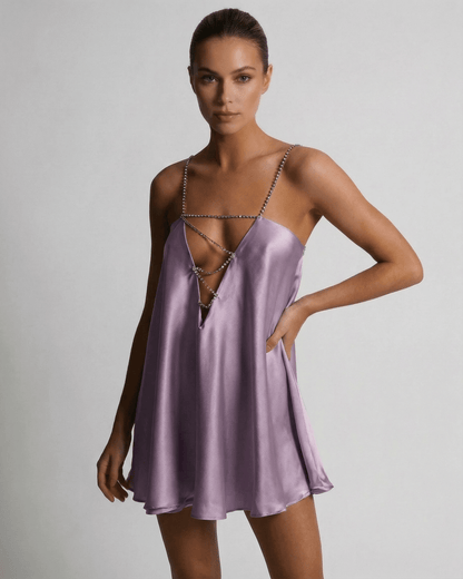 Model wearing the Lyra Mini Dress by Lauven, a luxurious lilac satin A-line dress with rhinestone detail.