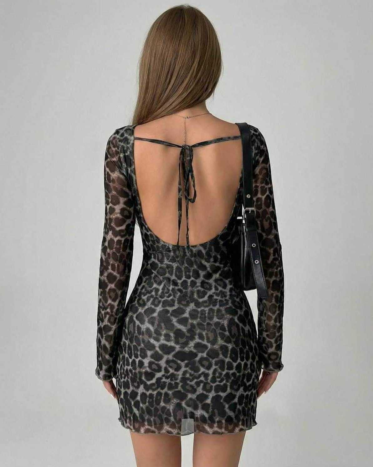 Lyra Mini Dress by Lauven featuring chic leopard print mesh design and elegant back detailing.