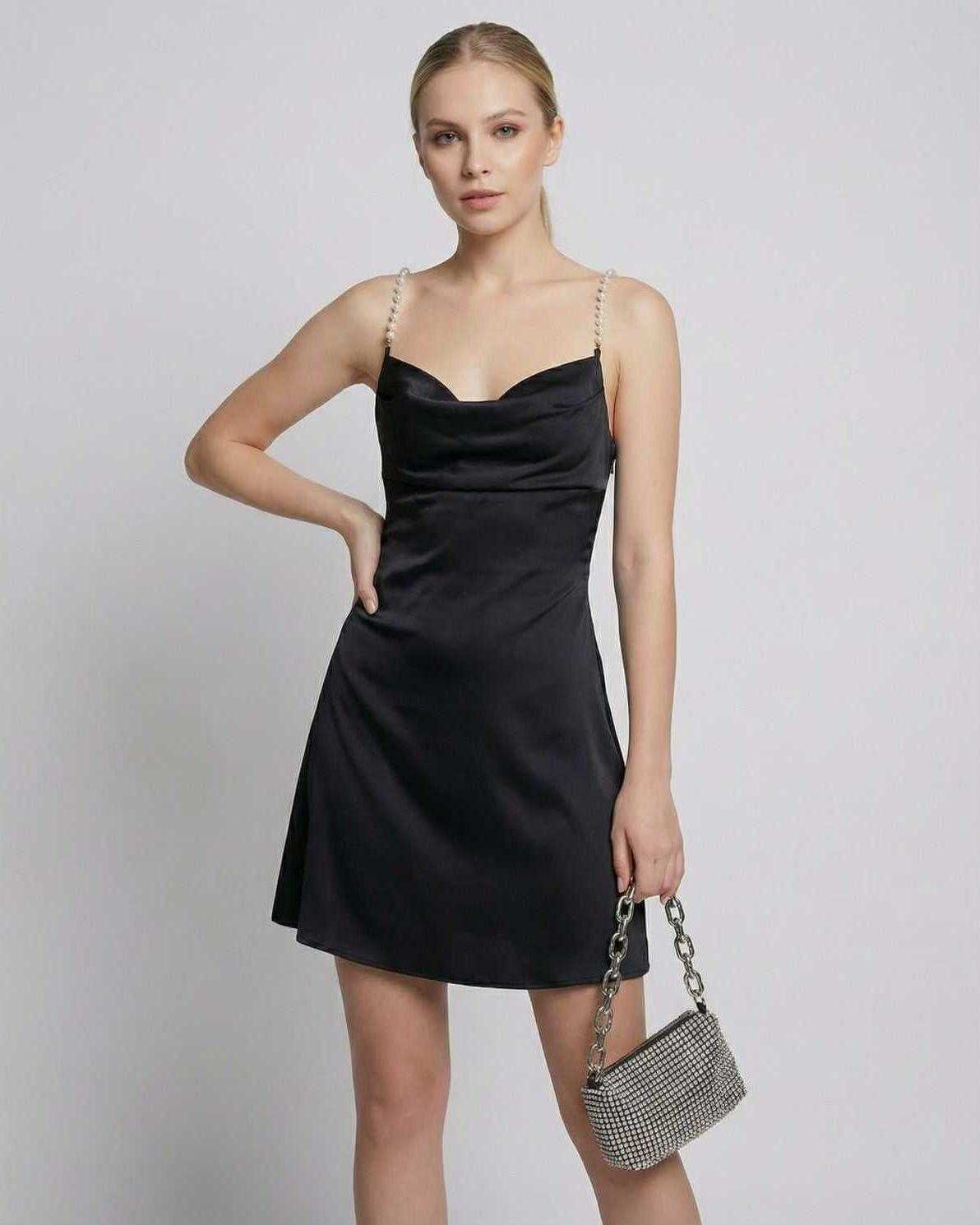 Lyra Mini Dress by Lauven - Elegant black satin sheath mini dress with pearl strap detail and draped neckline.