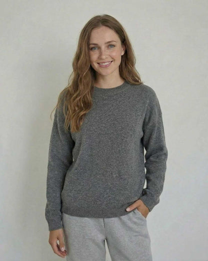 Lyra Pullover by Lauven - Soft wool knit sweater in a relaxed silhouette on a smiling model.