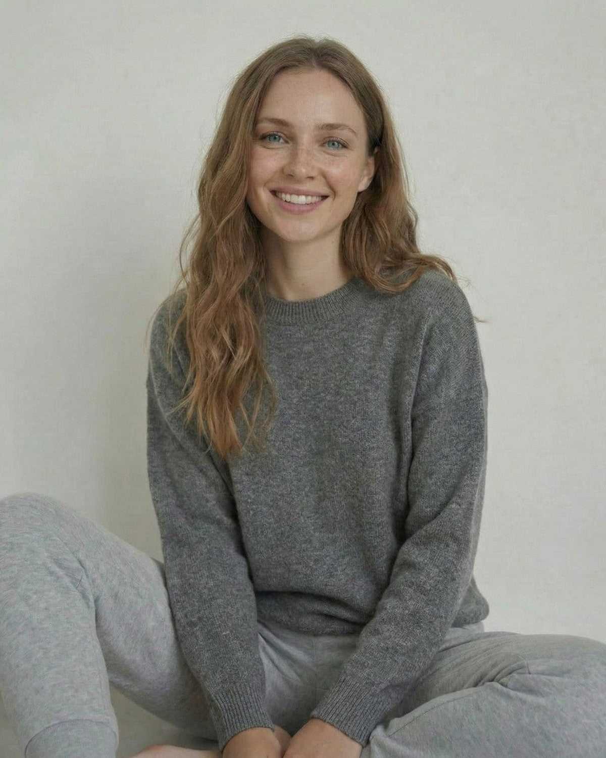 Lyra Pullover by Lauven, woman wearing a soft wool knit sweater in grey, relaxed fit and comfortable style.