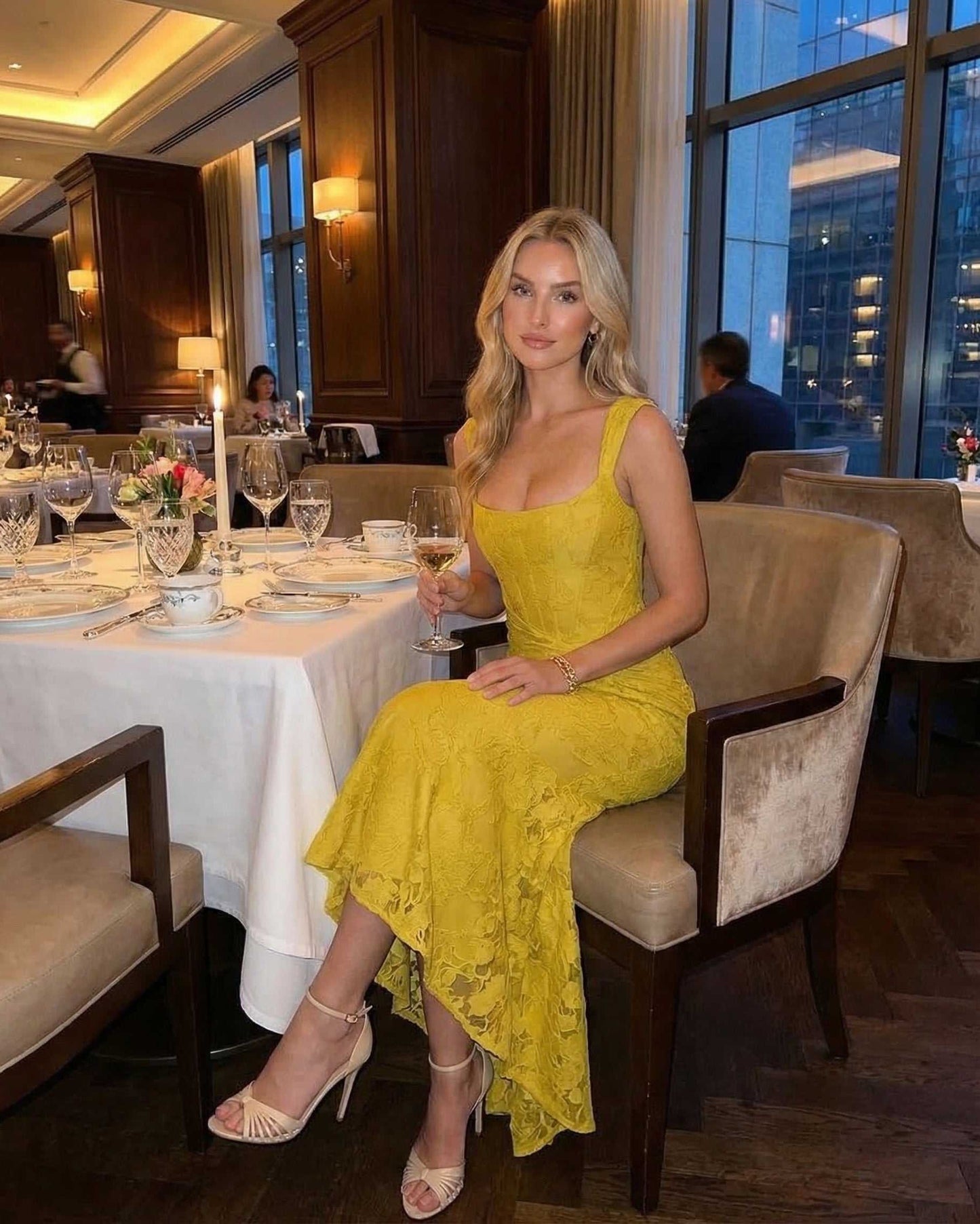 Model wearing Marigold Maxi Dress by Lauven, elegant yellow jacquard dress with square neckline and fish tail hem.