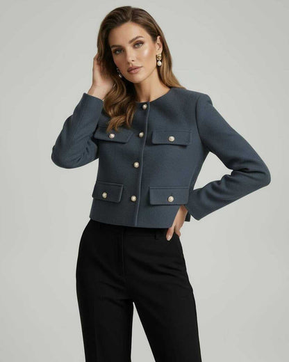Marina Jacket by Lauven in slate blue with gold button details and cropped silhouette worn by a model.