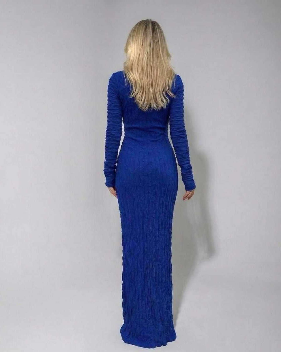 Back view of Lauven Marina Maxi Dress in royal blue, showcasing the textured knitted fabric and full-length sleeves.