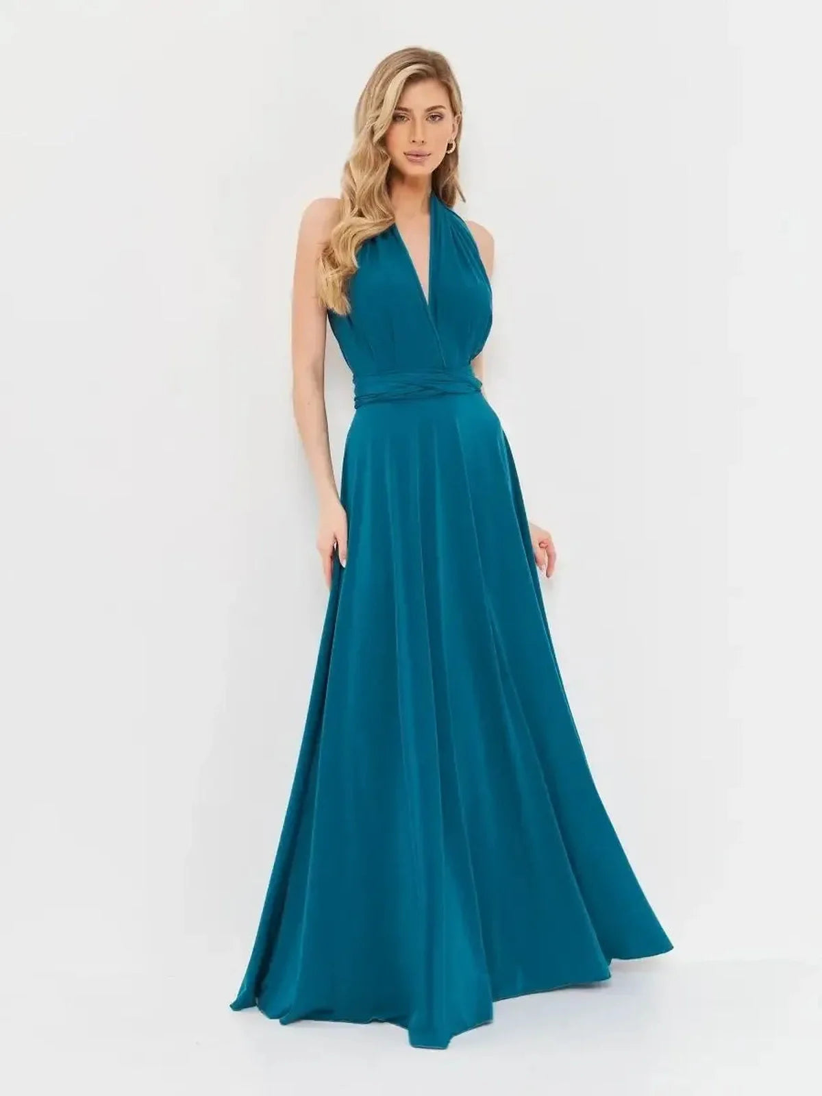 Elegantly draped deep teal maxi dress with halter neckline, designed for versatile styling at events and special occasions.