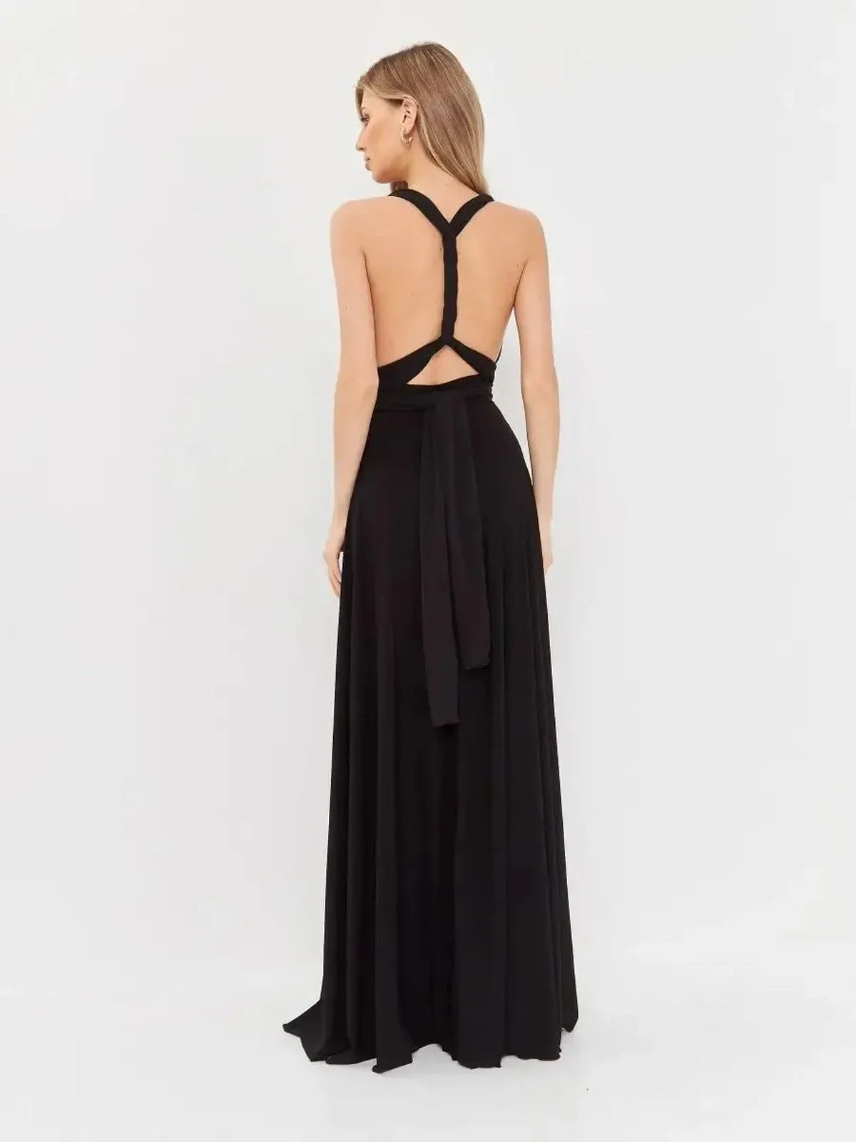 Back view of a black Maxi Dress Eclipse Drape showcasing a convertible open-back design and elegant flowing silhouette.