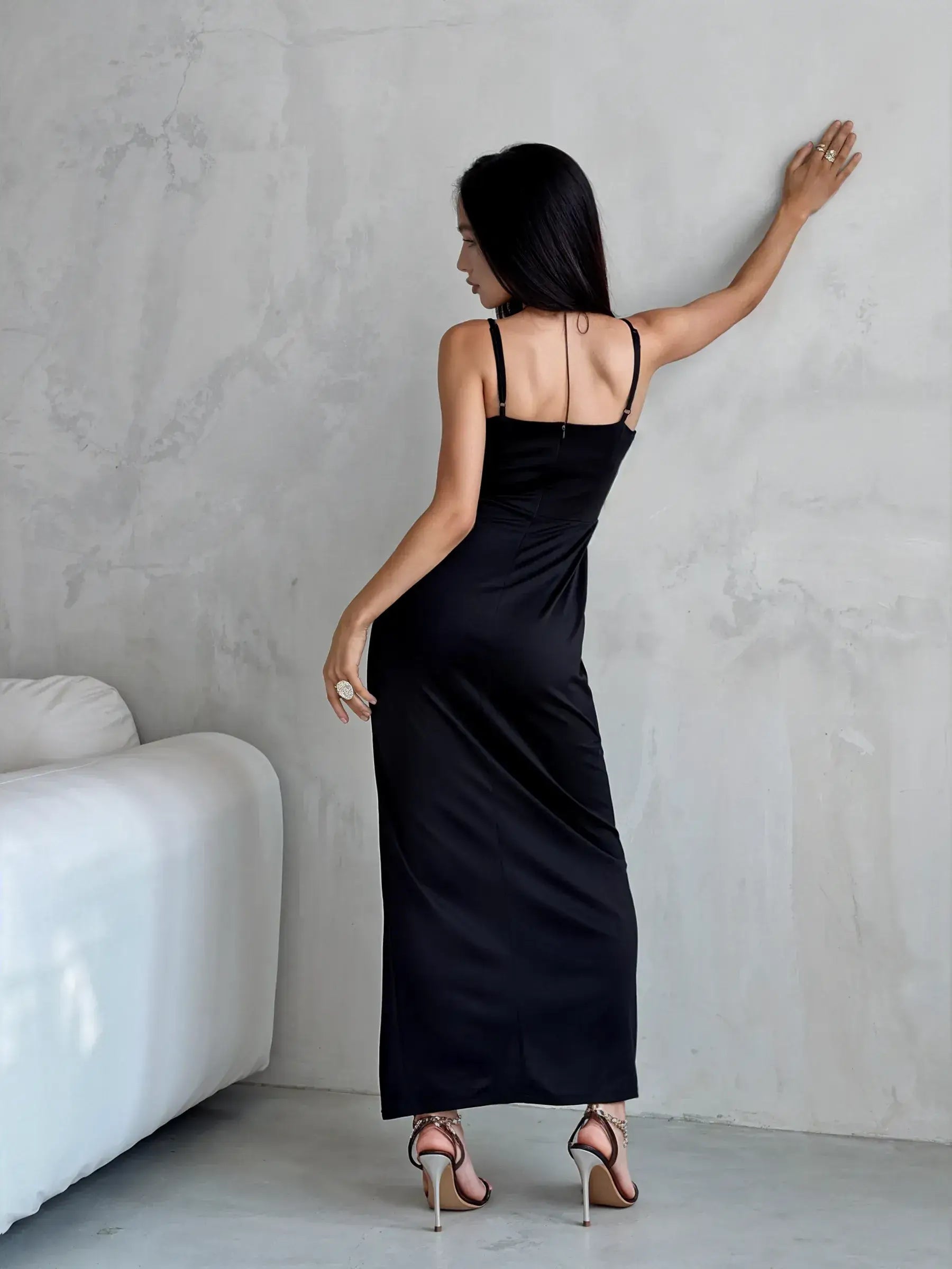 Elegant black maxi dress with a V-neck, featuring a back view, perfect for evening wear and summer events.