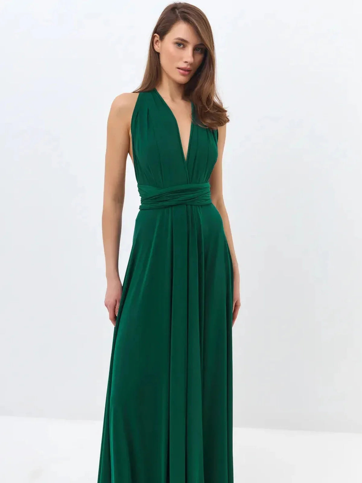 Model wearing a dark green Maxi Dress Empress Drape with a V-neckline and elegant flowing silhouette.