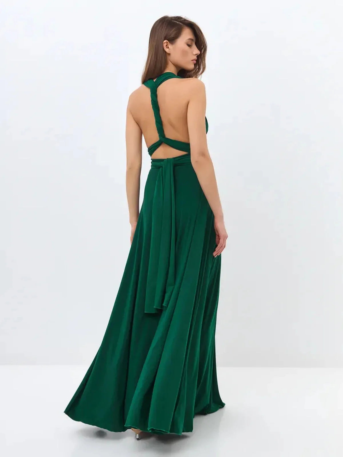Back view of the Maxi Dress Empress Drape in dark green, showcasing a wrap-style bodice and dramatic open back.