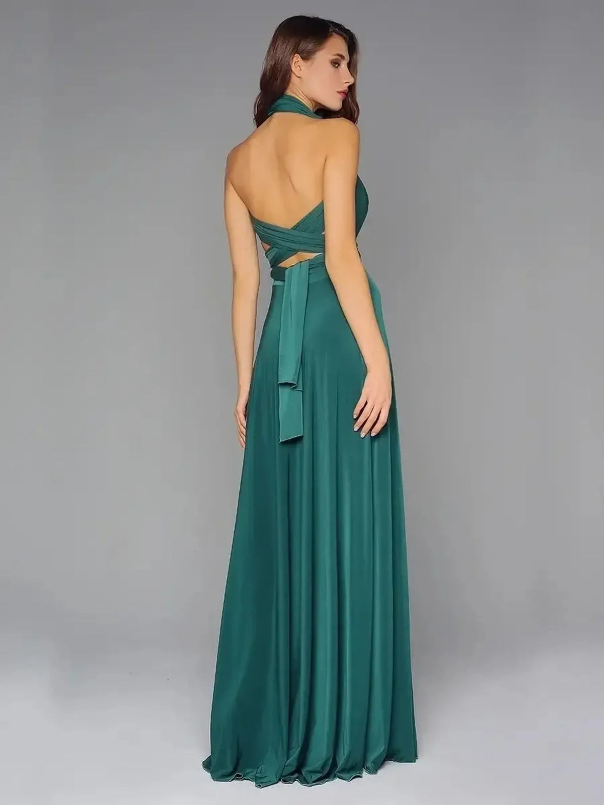 Back view of a dark green Maxi Dress Empress Drape with flowing silhouette and convertible straps.