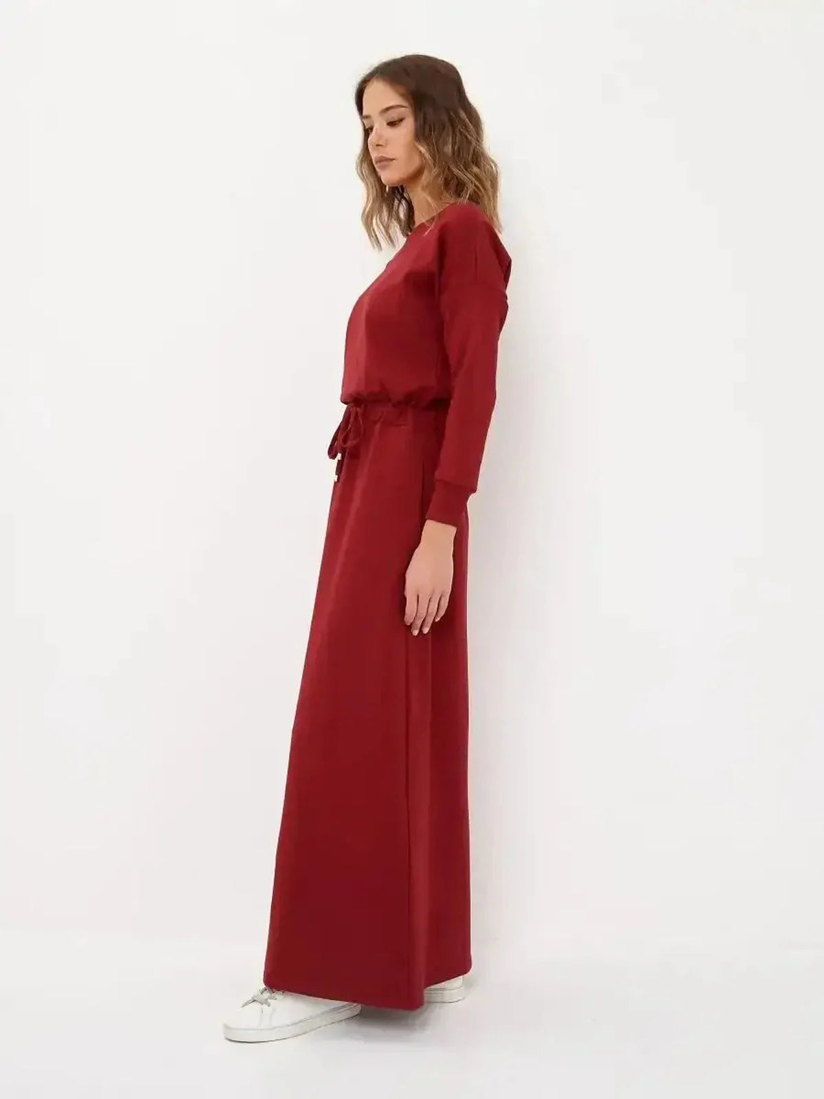 Elegant red maxi dress with long sleeves and a drawstring waist, ideal for wedding guests and formal occasions.