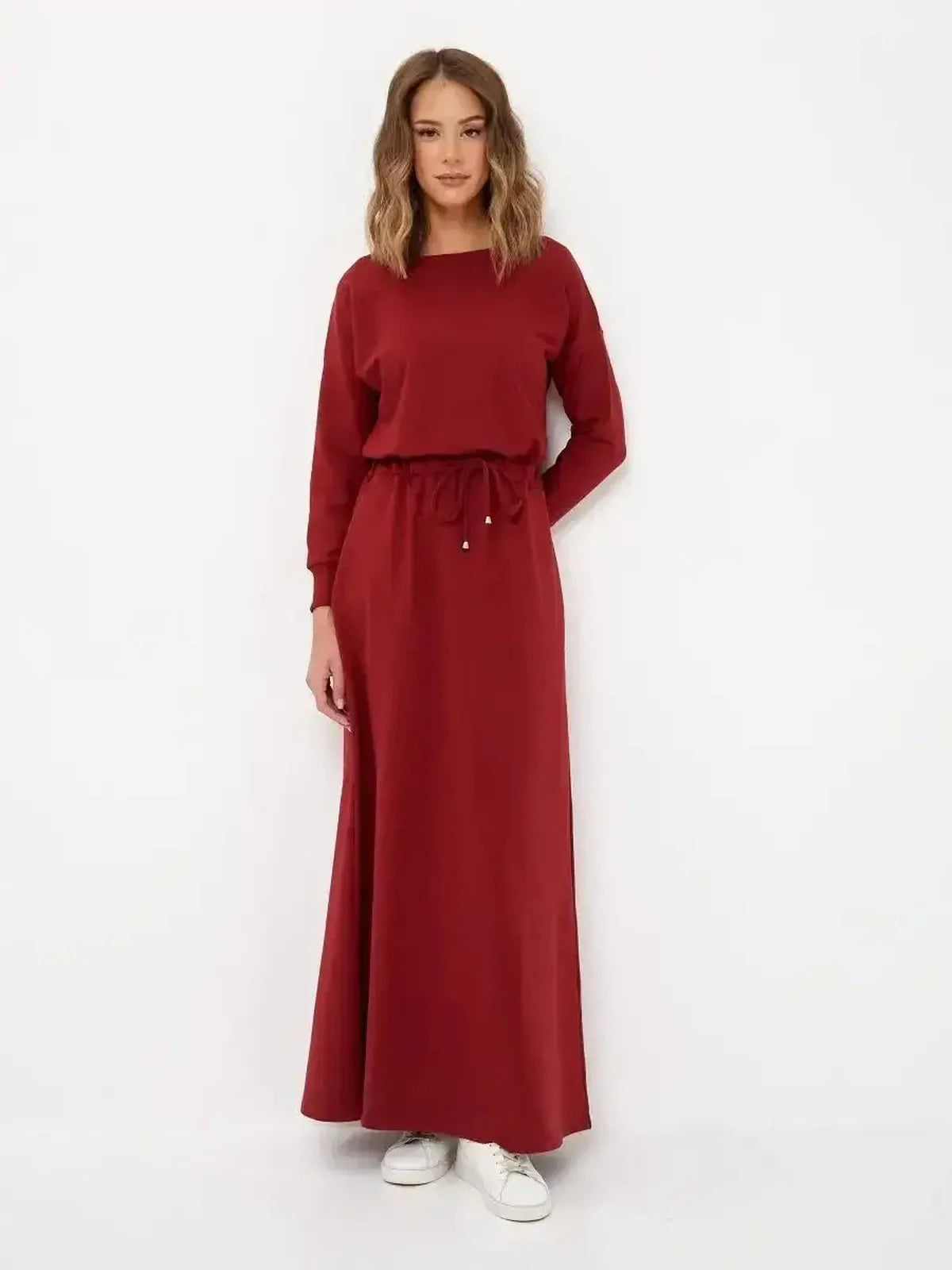 Elegant red maxi dress with long sleeves and soft drawstring waist, perfect for casual chic and formal occasions.