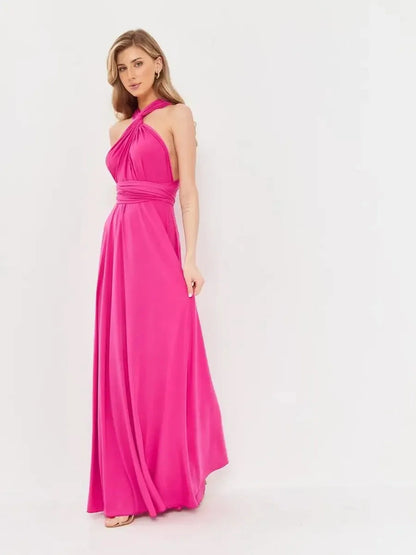 Maxi Dress Lush Twist in vibrant pink fuchsia, featuring a halter neckline and elegant draped design for versatile styling.