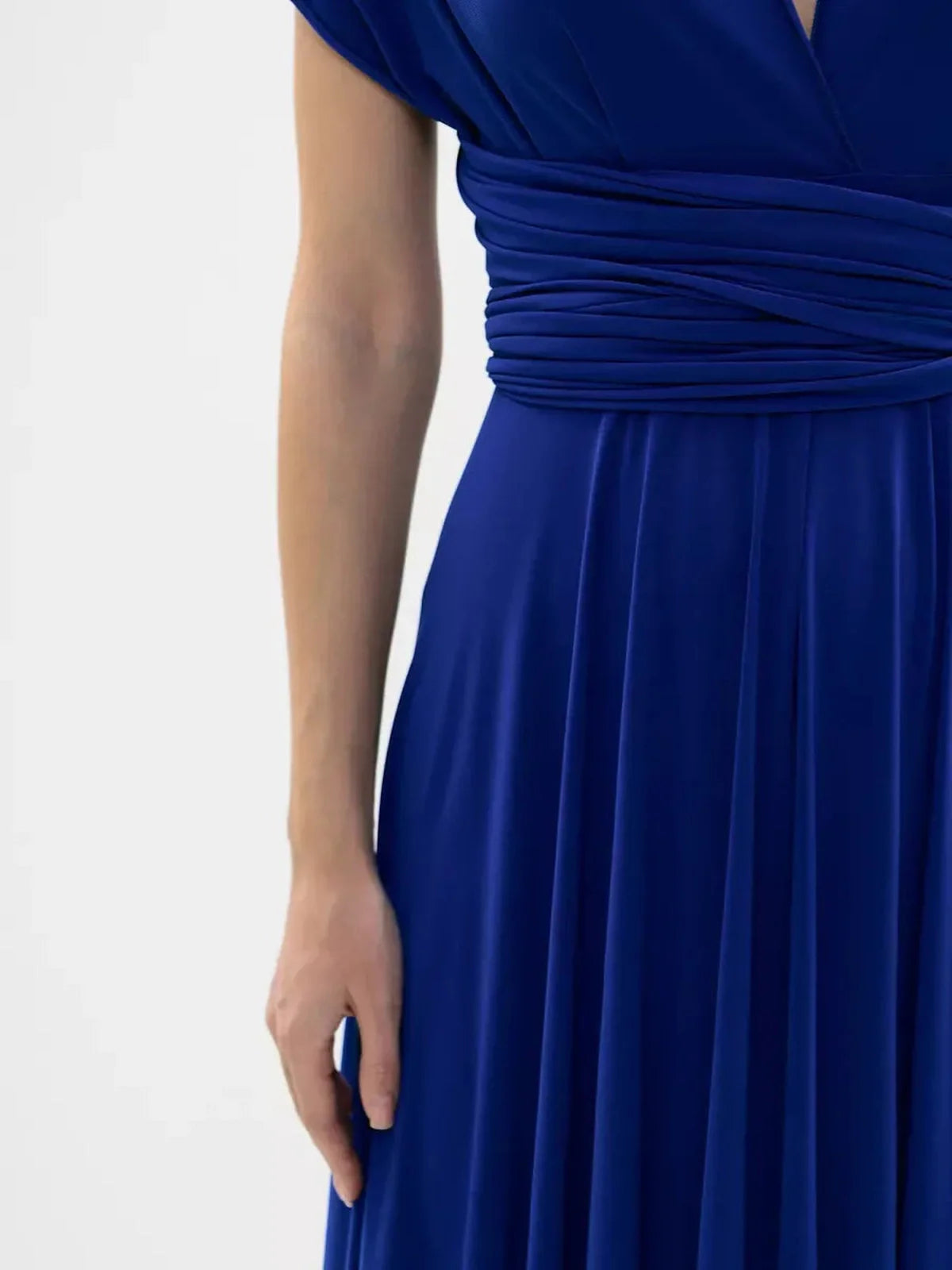 Close-up of the waist detail on a vibrant blue maxi dress showcasing elegant twist design.