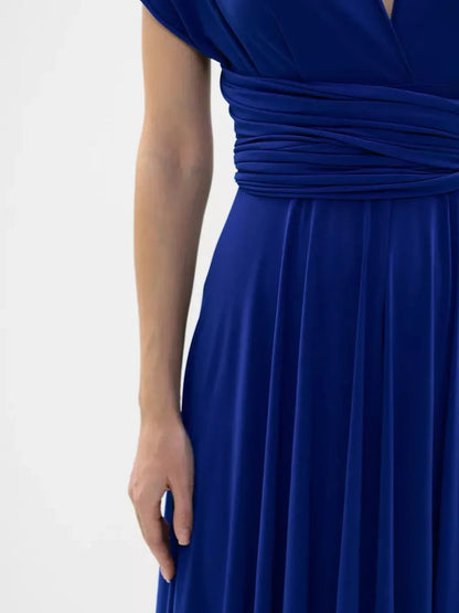 Close-up of the waist detail on a vibrant blue maxi dress showcasing elegant twist design.