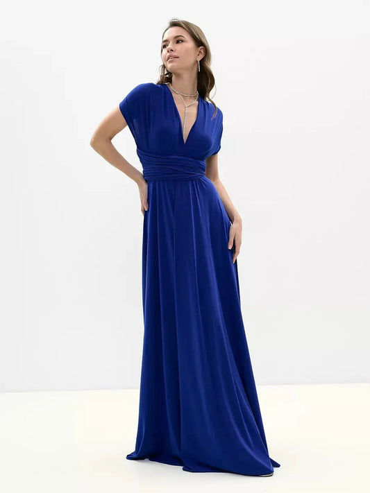 Model wearing a vibrant blue maxi dress with a deep V neckline and flowing silhouette, perfect for formal occasions.