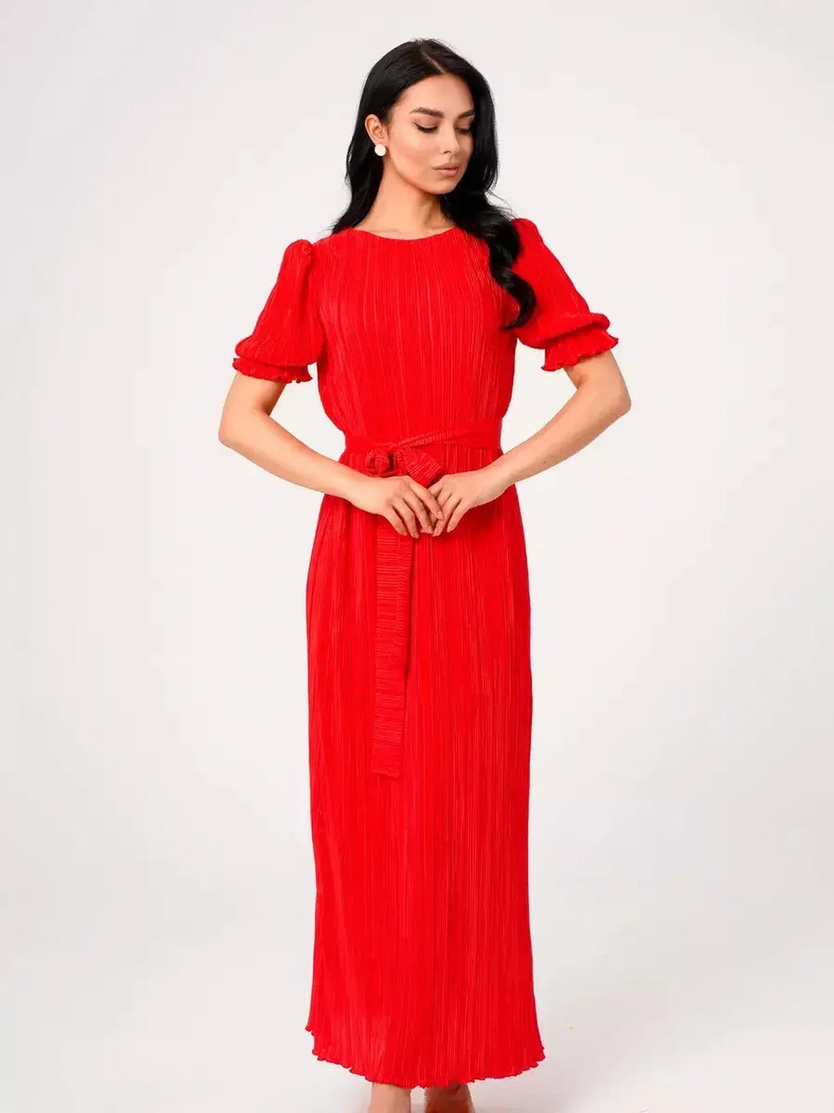 Red pleated maxi dress with puff sleeves and a belted waist, perfect for summer events or wedding guest attire.