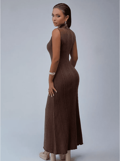 Elegant woman in a brown cable knit maxi dress showcasing a sculpted silhouette and mock neckline.