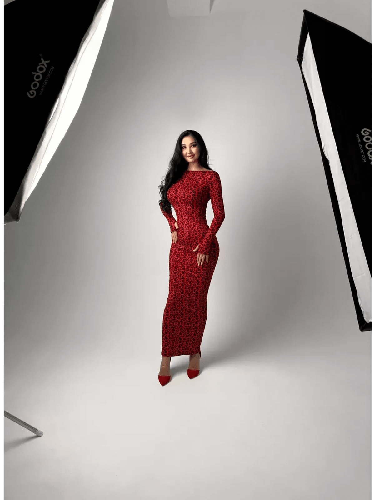 Model wearing the Wild Inferno Maxi Dress, featuring a bold leopard print and long sleeves, exuding confidence and elegance.