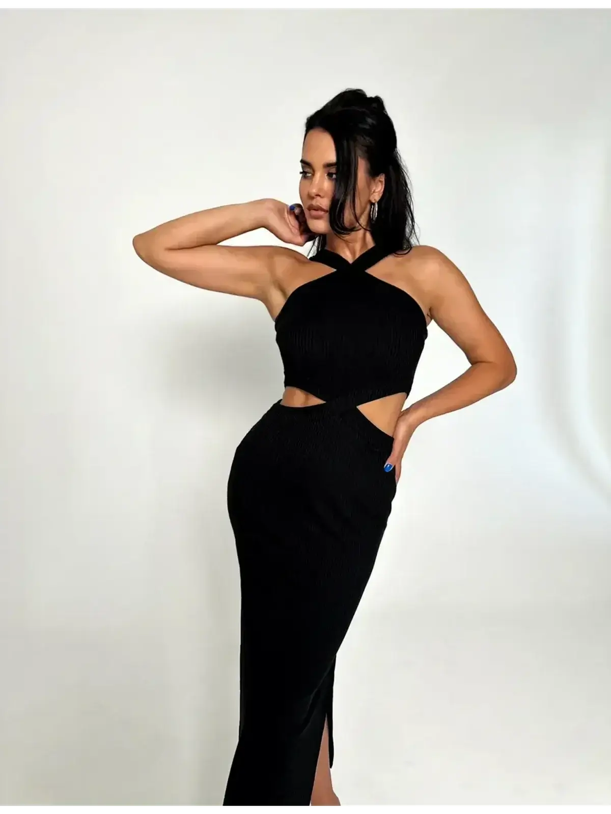 Model showcasing Midnight Allure Midi Dress with cutout waist, ribbed texture, and sultry side slit.