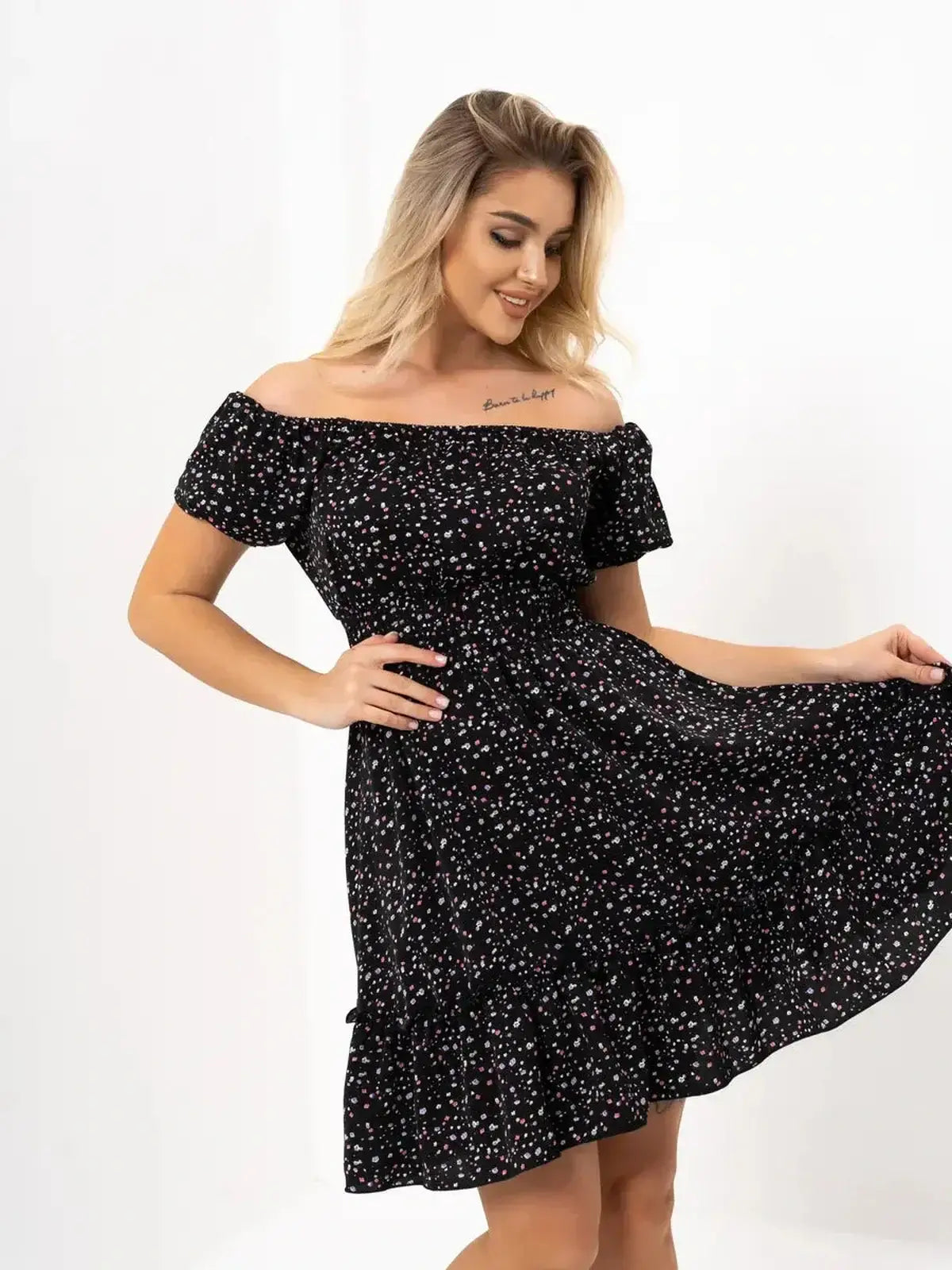 Elegant off-shoulder black dress with floral pattern, perfect for summer weddings and special occasions.