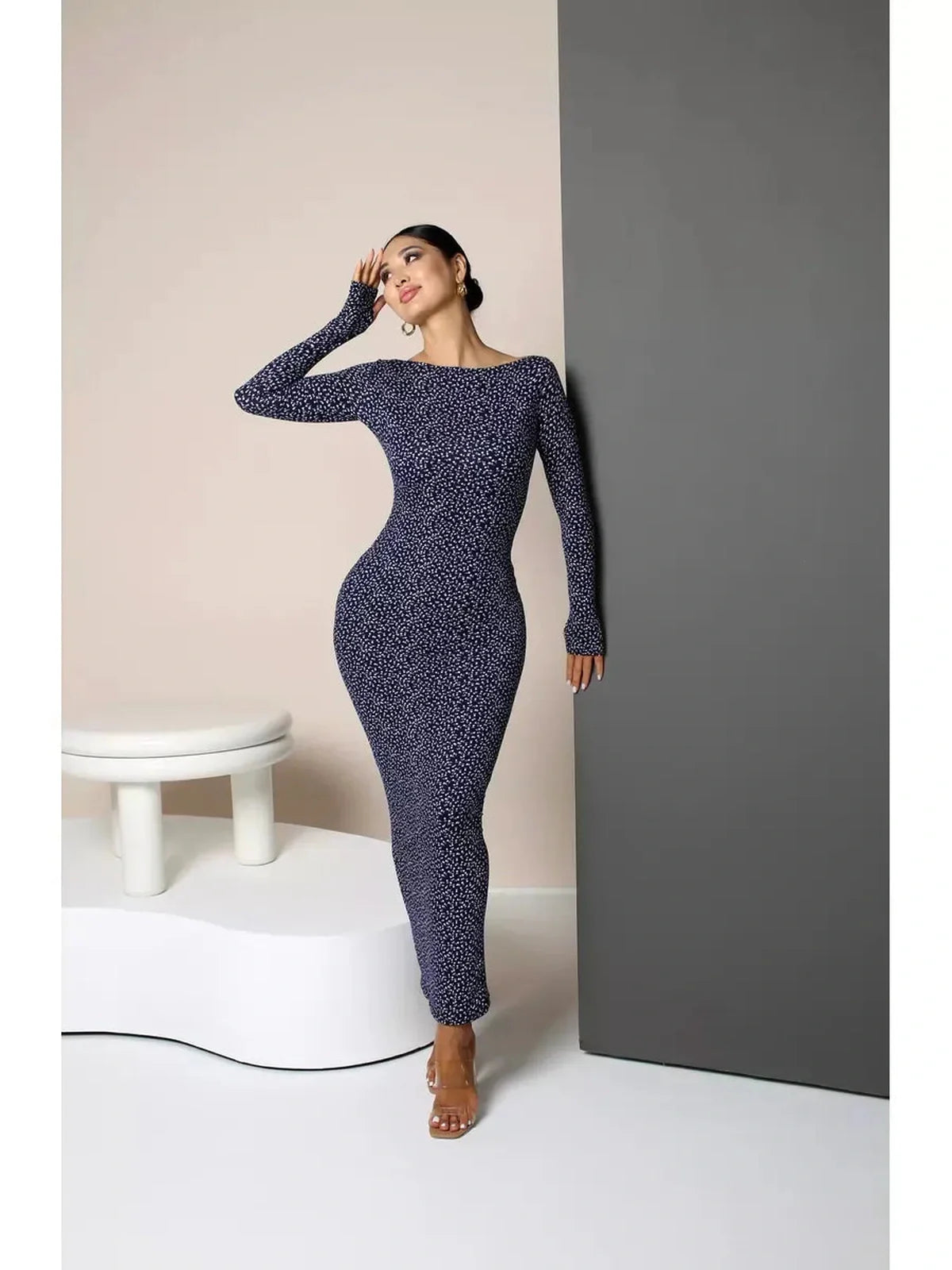 Model showcasing the Midnight Curve Maxi Dress in dark navy, highlighting its sculpted fit and elegant silhouette.