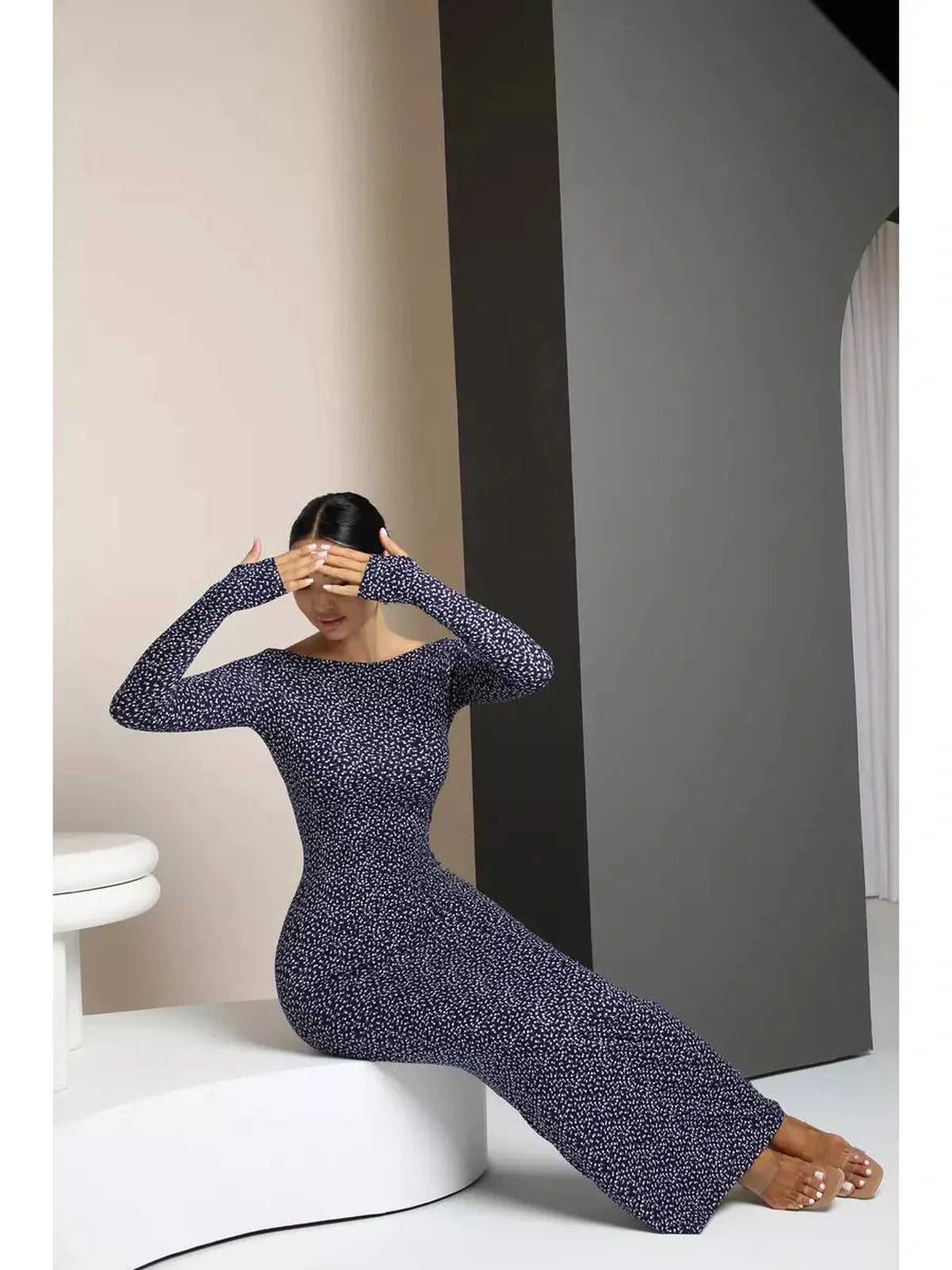 Midnight Curve Maxi Dress in dark navy, featuring thumbhole sleeves and a sculpting fit for an elegant silhouette.