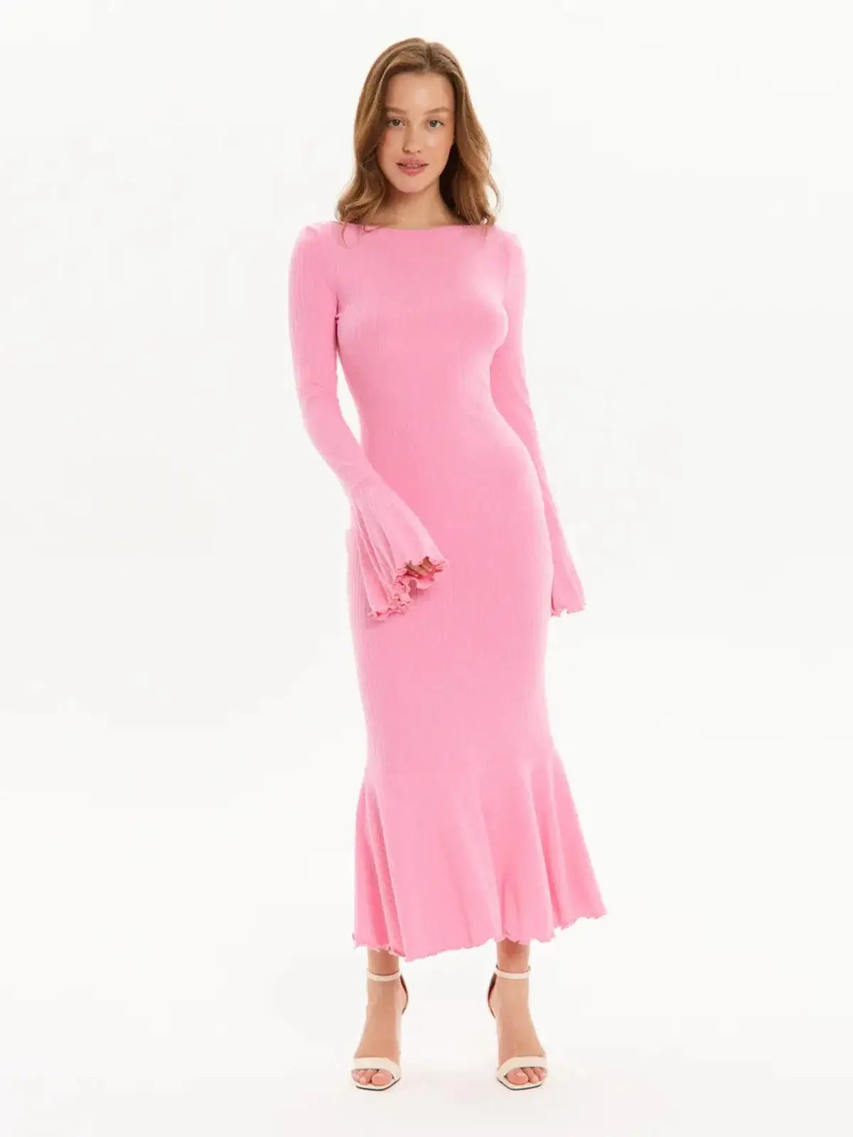 Pink midi dress with flared hem and bell sleeves, perfect for wedding guests and formal occasions.
