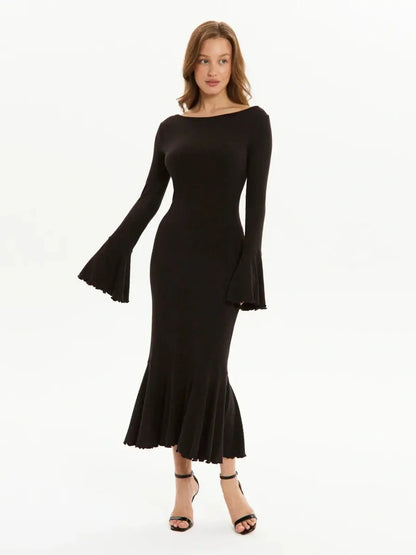 Elegant black midi dress with bell sleeves and a flared hemline, perfect for weddings and evening events.