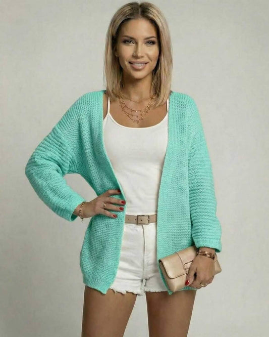 Model wearing Mint Aura Cardigan by Lauven in mint green, showcasing a relaxed fit and open front design.