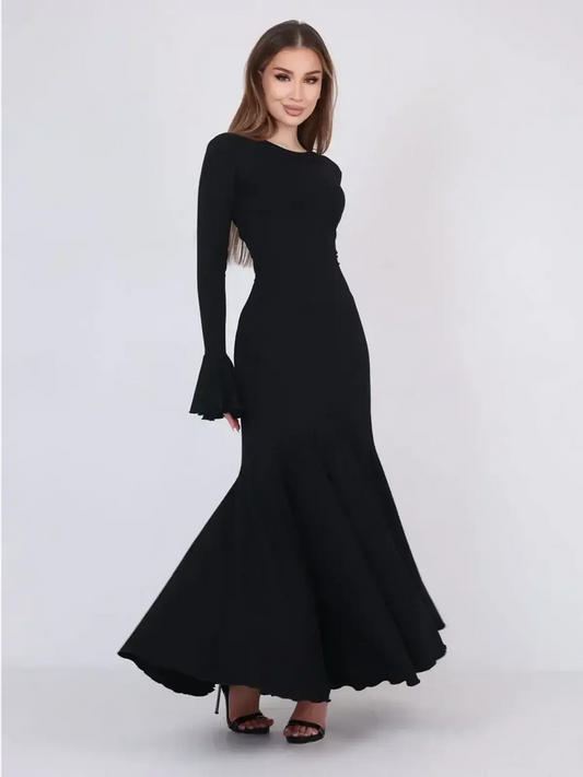 Mirage Maxi Dress in black, featuring flared cuffs and a fishtail hem for an elegant evening or formal look.